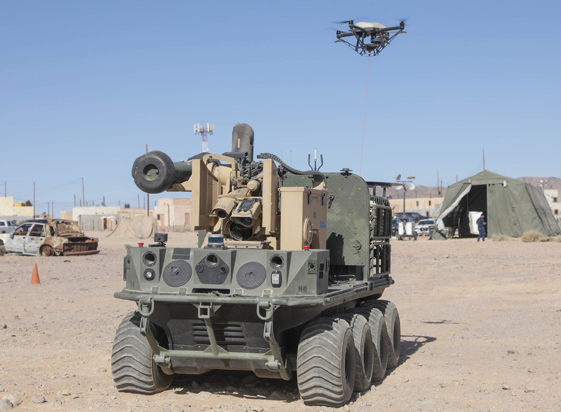 A U.S. Army Origin autonomous weapons system uses a tethered unmanned aerial system to help Soldiers perform reconnaissance during Project Convergence 2022 experimentation at Fort Irwin, CA. (Credit: SPC Jaaron Tolley)